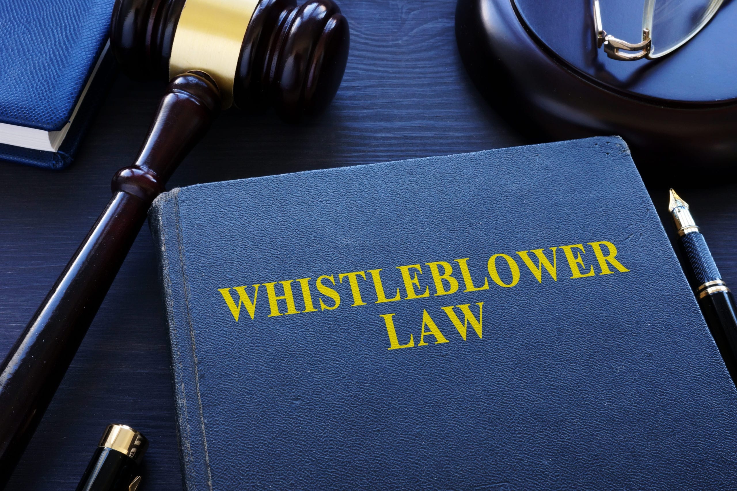 Whistleblower law book on a desk