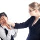 Female supervisor slapping a female employee.