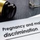 Pregnancy Discrimination laws laying on a desk.