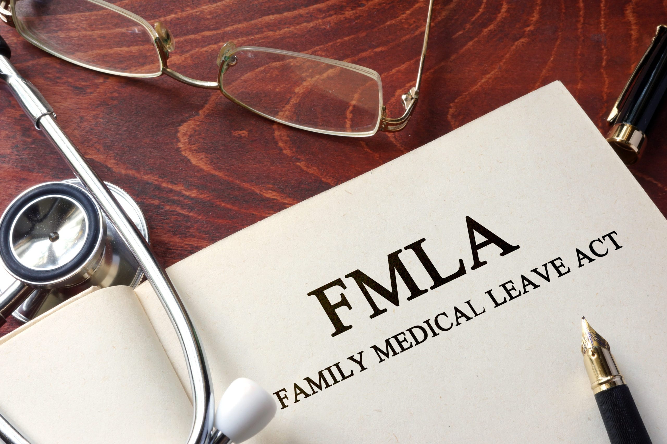 FMLA form on a doctor's desk.