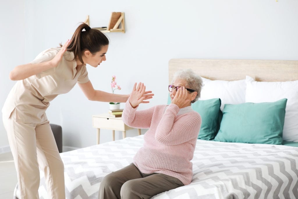 Nursing home employee abusing a nursing home resident.